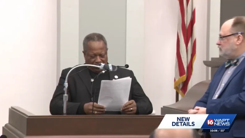 News still: a witness reads testimony at the podium in Hinds County Circuit Court, WAPT, February 27, 2026