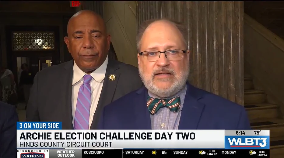 News still: Matt Wilson in a Hinds County courthouse hallway, WLBT, February 27, 2026